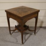 A late Victorian rosewood and marquetry inlaid envelope card table, with frieze drawer and under