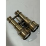 A pair of Victorian polished brass binoculars with telescopic shades