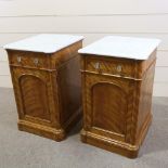 A pair of 19th century satinwood pedestal cupboards, with shaped white marble tops, single frieze