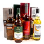 4 bottles of single malt whisky, The Ardmore, Auchentoshan American Oak, Penderyn (Welsh), and an