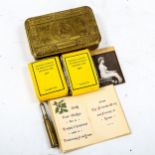 A 1914 Queen Mary Christmas tin with original contents, including bullet pencil and cigarettes