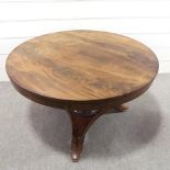 A 19th century Manx circular mahogany tilt-top dining table on stylised platform base, diameter