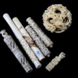 A 19th century Chinese carved ivory puzzle ball, and various ivory needle cases