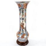 A Chinese 19th century porcelain sleeve vase, with hand painted and gilded decoration, on original