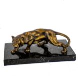 A gilded spelter prowling tiger sculpture, on black marble base, length 22cm