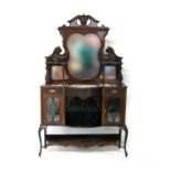 Victorian mahogany salon cabinet, circa 1890, shaped triple mirrored back carved with cornucopia and