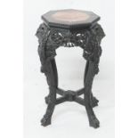 Chinese carved hardwood jardiniere stand, late 19th Century, the octagonal top with marble inset