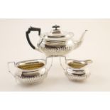 George V silver three piece tea service, Sheffield 1925, comprising teapot, sugar basin and milk
