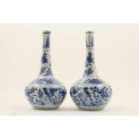 Chinese matched pair of blue and white bottle vases, 18th or 19th Century, decorated with birds