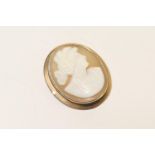 Cameo brooch, carved with a profile of a young woman, in a 9ct gold mount, 35mm