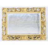 Florentine style carved gilt framed wall mirror in the Baroque style, early to mid 20th Century,