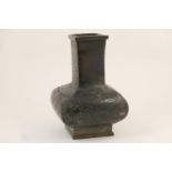 Oriental bronze vase, 20th Century, of baluster square section with archaic style chiselled