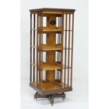 Ashford & Co., London, American patent ash revolving bookcase, having four tiers over a cross form