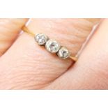 Diamond three stone ring, having three small old round brilliant cut diamonds, total weight