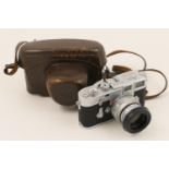 Leica M3 Rangefinder camera, no. 919246; together with an Elmar F=9cm 1.4 lens, no. 1493460; with