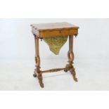 Victorian burr walnut sewing table, circa 1850, the shaped rectangular top opening to a fitted