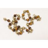 9ct gold and tiger's eye beaded necklace, having alternating beads joined with chain links, with