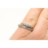 Diamond five stone ring, having small round brilliants in a millegrain illusion platinum setting, on