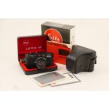 Leica M6 camera, serial no. 1689330, with a Summicron 50mm f/2 lens, no. 2386101, with instructions,