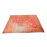 Ushak woollen carpet, circa 1900-30, the deep red field faded to one side, dispersed with