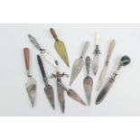 Small collection of silver trowel and other bookmarkers including two of sword form, each with