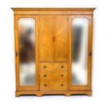 Late Victorian satinwood bedroom suite, circa 1880, comprising triple wardrobe with dentil and