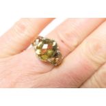 Decorative topaz and diamond dress ring, the oval chequerboard topaz stones dispersed with tiny