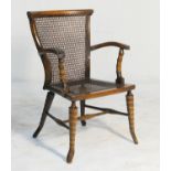 George V stained beech bergere armchair, by Allen & Appleyard, Liverpool, caned back and seat,