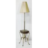 French walnut and brass extending standard lamp table, circa 1900-20, the ratchet column over a