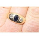 Sapphire and diamond gypsy ring, the oval cut sapphire of approx. 0.75ct in a rub over setting,