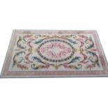 Fine quality Aubusson style woollen carpet, ivory field centred with a laurel leaf oval and pink