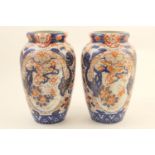 Pair of Japanese Imari vases, Meiji (1868-1912), ovoid form decorated with panels of pheasant amidst