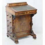 Victorian burr walnut and inlaid davenport, circa 1860, the leather inset sloping top with an
