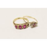 Ruby and diamond three stone ring, the small round brilliant cut stones in a crossover setting in