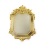 French giltwood and gesso cushion framed mirror, in Louis XV style, circa 1860-80, canted