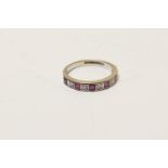 Ruby and diamond half eternity ring, in 18ct white gold, set with six square cut rubies and five