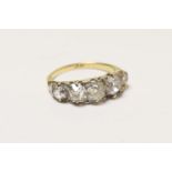 Diamond five stone ring, having five old cushion cut stones graduating in size, the central stone