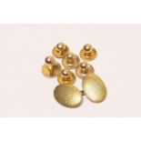 Four Victorian 15ct gold shirt studs, weight approx.3.4g; also a 9ct gold cufflink with engine