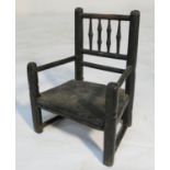 Primitive child's chair, early 19th Century, with spindle back, open arms and solid seat, width