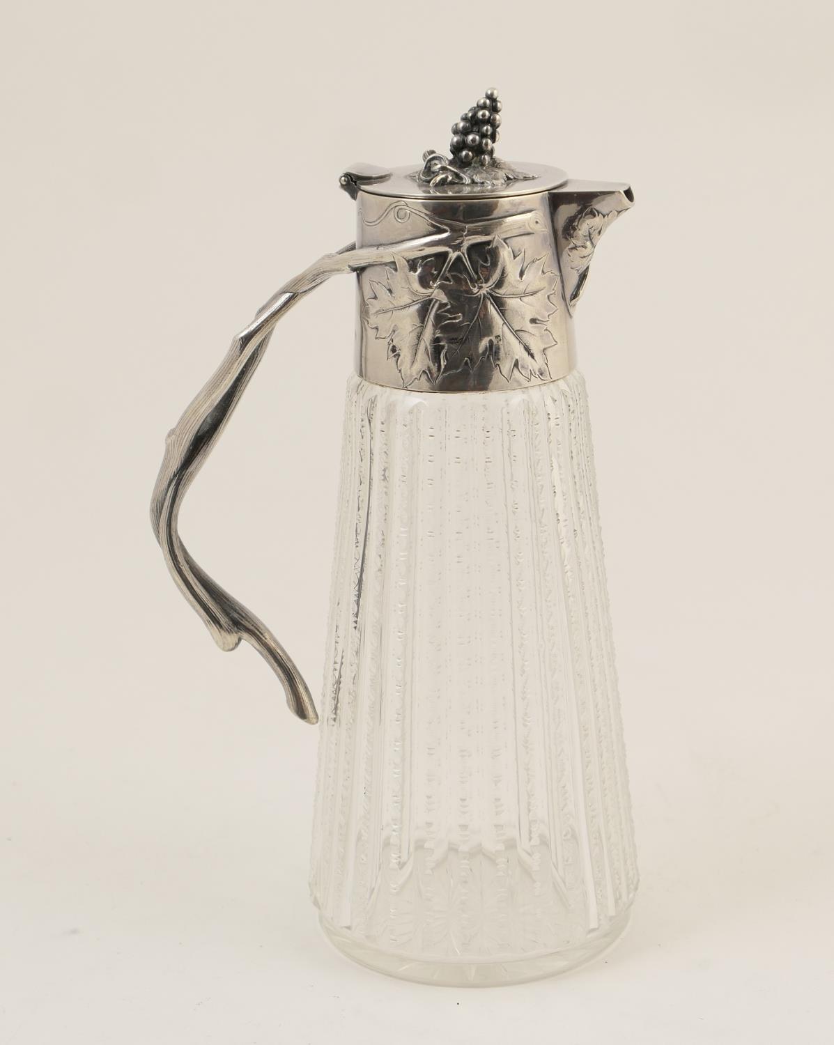 Late Victorian cut glass claret jug, circa 1900, having silver plated mounts and hinged lid,