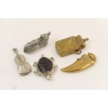 Five novelty vesta cases comprising Queen Victoria's Jubilee brass commemorative, 7cm; brass tooth