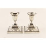 Pair of Edwardian silver dwarf candlesticks by Hawksworth Eyre & Co., Sheffield 1909, urn shaped