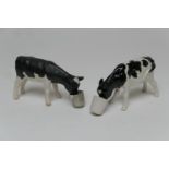 John Harper for Shebeg Pottery, Isle of Man, two Friesian calves, one glazed, the other matte,