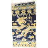 Traditional Chinese woollen pillar rug, 19th Century, having a five toed dragon clutching a