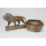 After Barye, a polished bronze sculpture of a lion, the base bearing a signature, height 26cm,