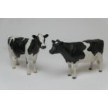 John Harper for Shebeg Pottery, Isle of Man, a Friesian cow, height 15.5cm; also Friesian cow '