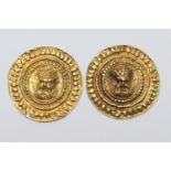 Pair of antique gold mounts, circular form centred with a mask of Zeus, within a radial punched