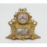 French gilt ormolu and Sevres porcelain mantel clock, having a Rose Pompadour and floral decorated