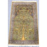 Kashan woollen prayer rug, the green field with a foliate tree of life with birds amidst its