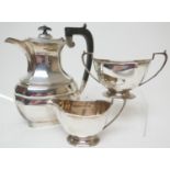 Modern silver hot water jug, Birmingham 1961, with ebony handle and finial, height 23.5cm, gross